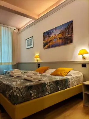 Letto o letti in una camera di Hotel Camilla Firenze