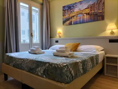 Letto o letti in una camera di Hotel Camilla Firenze