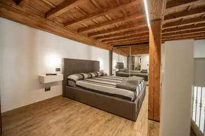 Letto o letti in una camera di Sunrise Apartment by Mamo Florence