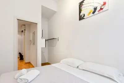 Letto o letti in una camera di GuestHost - Piazza Oberdan Patio Apartment