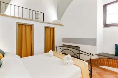Letto o letti in una camera di GuestHost - Le Tre Volte - Mercato Centrale Charming Loft