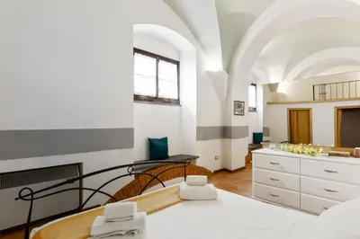 Letto o letti in una camera di GuestHost - Le Tre Volte - Mercato Centrale Charming Loft