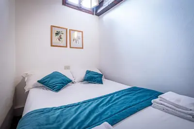 Letto o letti in una camera di Roommo Oltrarno