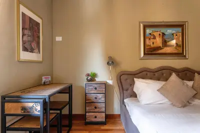 Letto o letti in una camera di PONTE VECCHIO STUDIO 2