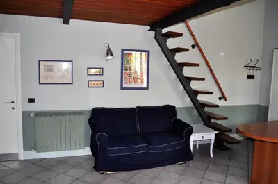Area soggiorno di Grazioso appartamento in centro con terrazza privata