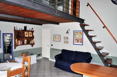 Area soggiorno di Grazioso appartamento in centro con terrazza privata