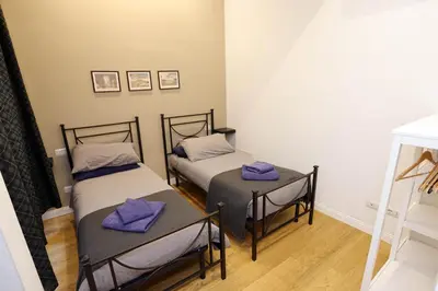 Letto o letti in una camera di New Quiet Central Flat - Casa del Fotografo