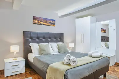 Letto o letti in una camera di Firenze Rooms Cathedral B&B