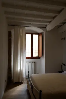 Letto o letti in una camera di A due passi da Ponte Vecchio