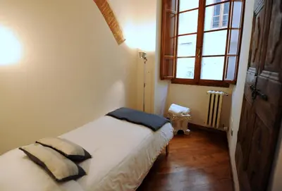 Letto o letti in una camera di Acacia Firenze - Quercia