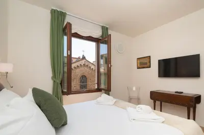 Letto o letti in una camera di San Remigio Apartment