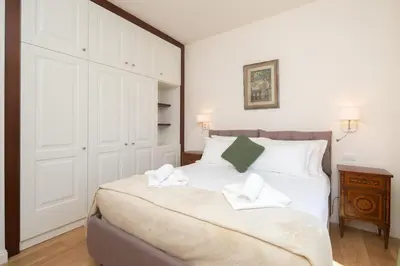 Letto o letti in una camera di San Remigio Apartment