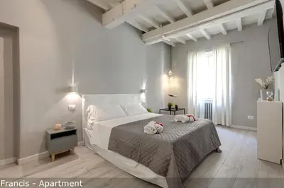 Letto o letti in una camera di Jake & Francis Apartments by Mamo Florence