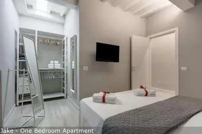 Letto o letti in una camera di Jake & Francis Apartments by Mamo Florence