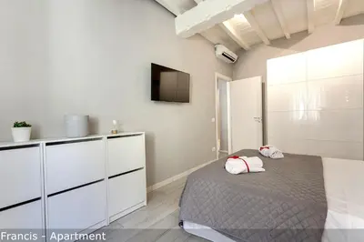 Letto o letti in una camera di Jake & Francis Apartments by Mamo Florence