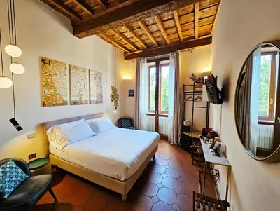 Letto o letti in una camera di SPIRIT OF FLORENCE Boutique Rooms