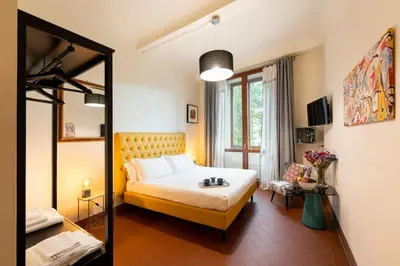 Letto o letti in una camera di SPIRIT OF FLORENCE Boutique Rooms
