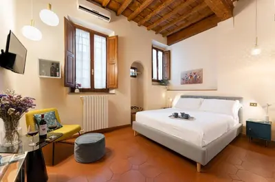 Letto o letti in una camera di SPIRIT OF FLORENCE Boutique Rooms