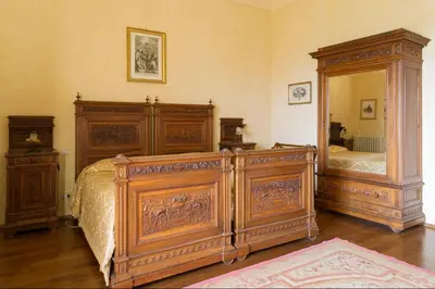 Letto o letti in una camera di Castello di Volognano