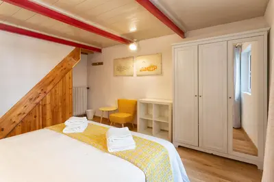 Letto o letti in una camera di Sprone House by 360Rentals