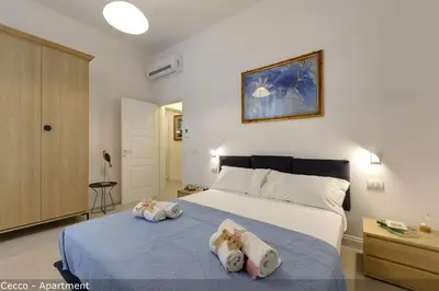 Letto o letti in una camera di Cavour Apartments by Mamo Florence