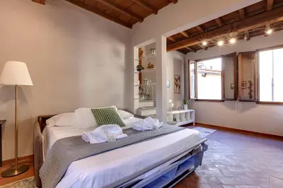 Letto o letti in una camera di Magazzini Apartment by Mamo Florence