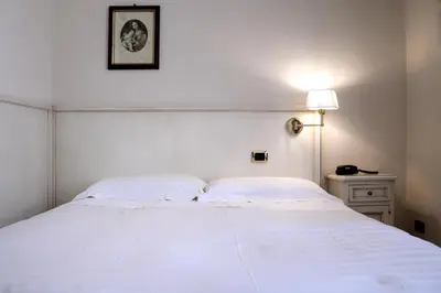 Letto o letti in una camera di Hotel Astro Mediceo