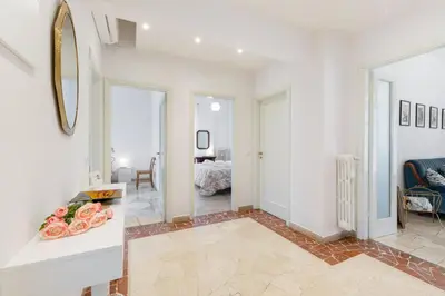 Letto o letti in una camera di GuestHost - Il Salotto Blu - Appartamento con Parcheggio