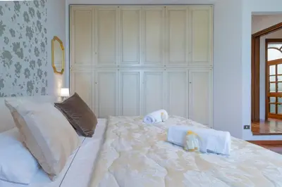 Letto o letti in una camera di Villa Lia - Apartment in Villa with private garden and Pool