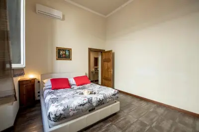 Letto o letti in una camera di Indipendenza Apartment by Mamo Florence