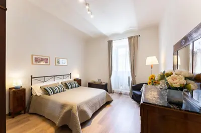 Letto o letti in una camera di Campuccio - Flo Apartments