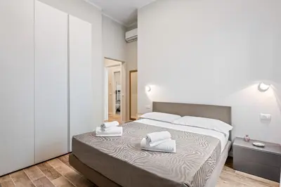Letto o letti in una camera di GuestHost - Maragliano Cozy Flat with Balcony