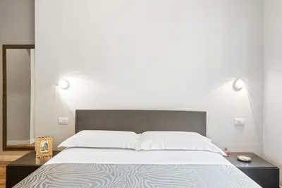Letto o letti in una camera di GuestHost - Maragliano Cozy Flat with Balcony