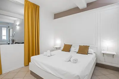 Letto o letti in una camera di GuestHost - Mercato Centrale Modern Flat