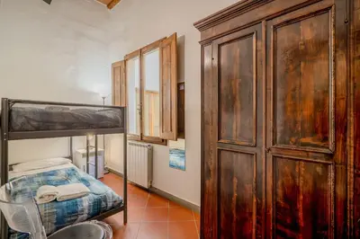 Letto o letti in una camera di GuestHost - Heart of Florence - San Lorenzo Lovely Apartment