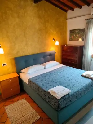 Letto o letti in una camera di MEDICI CHAPELS TERRACE - VIEW APARTMENT