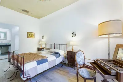 Letto o letti in una camera di Santa Maria Novella - Appartamento Il Vecchio Baule