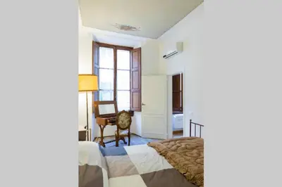Letto o letti in una camera di Santa Maria Novella - Appartamento Il Vecchio Baule