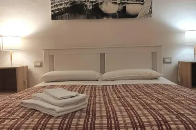 Letto o letti in una camera di Cozy apartment near Ponte Vecchio