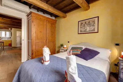 Letto o letti in una camera di Diciotto Apartment by Mamo Florence
