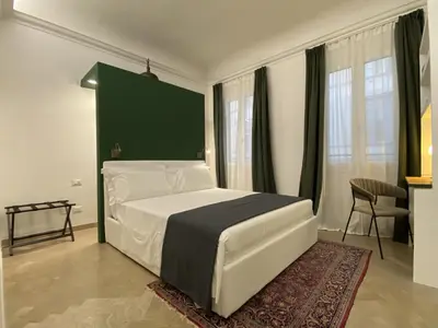 Letto o letti in una camera di San Lorenzo for foodies