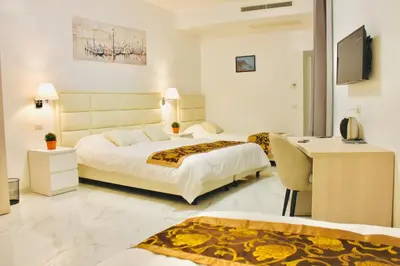 Letto o letti in una camera di Hotel 900 Toscana