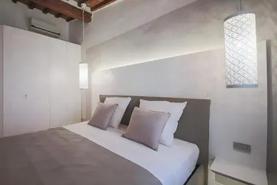 Letto o letti in una camera di Elegant and Bright Flat near the Duomo