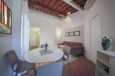 Area soggiorno di Elegant and Bright Flat near the Duomo
