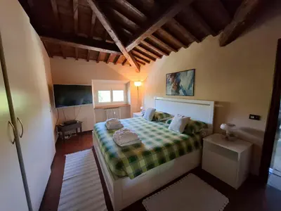 Letto o letti in una camera di Appartamento incantevole