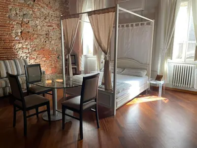 Letto o letti in una camera di Sant'Ambrogio Suite