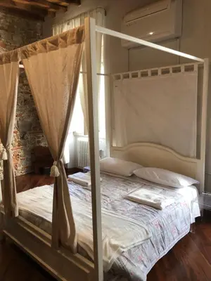 Letto o letti in una camera di Sant'Ambrogio Suite