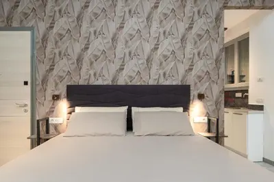 Letto o letti in una camera di F1RST Suite Apartment & SPA