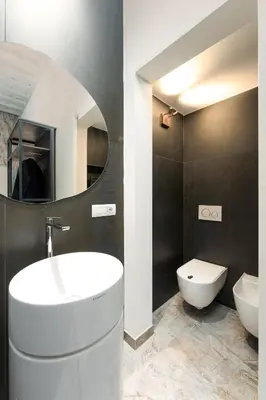 Bagno di F1RST Suite Apartment & SPA