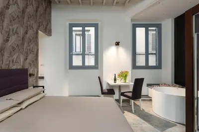 Letto o letti in una camera di F1RST Suite Apartment & SPA